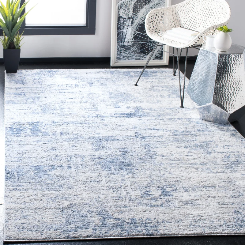 budget-friendly carpet for home renovations -SAFAVIEH Amelia Lorella Abstract Rug